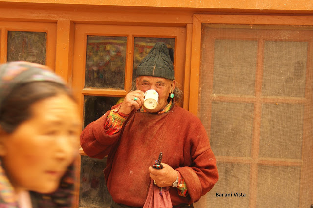 A pilgrim drinking butter tea