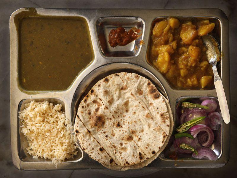 The Langar thali comprising of rice, roti, dal, and a vegetable dish