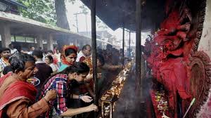 Devotees perform puja at the temple