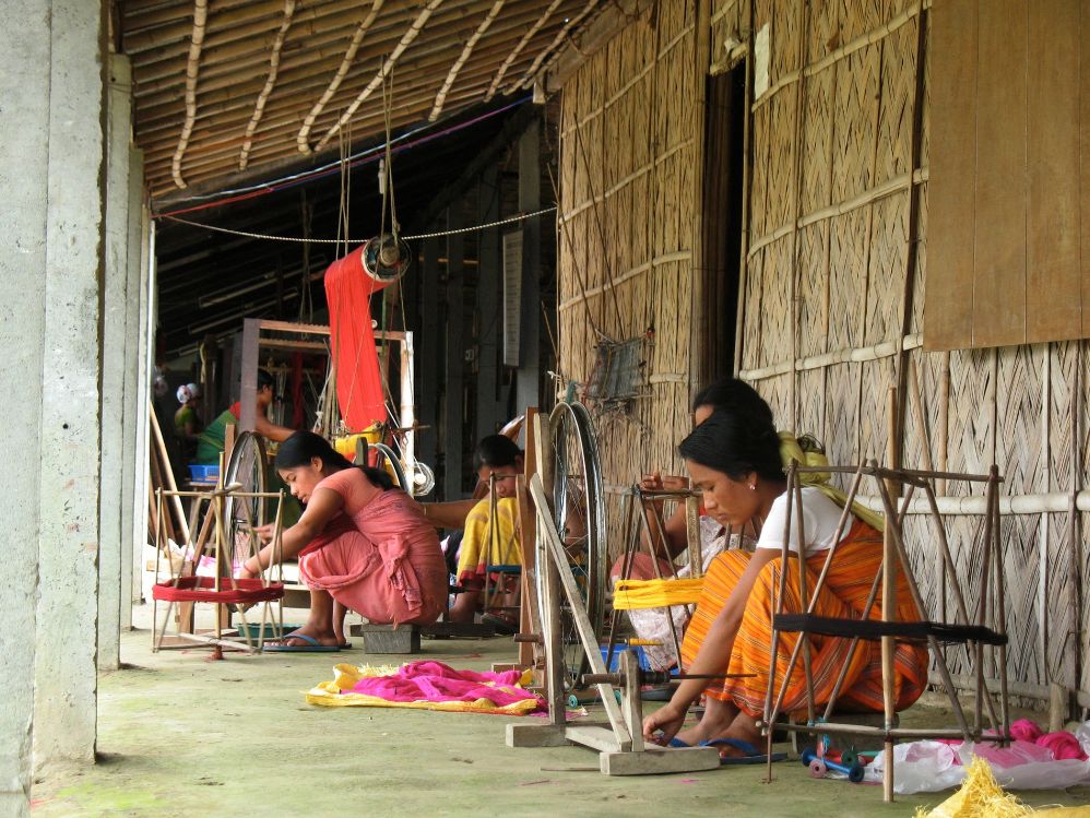 Bodo women engaged in the weaving process image courtesy: www.thealternative.in