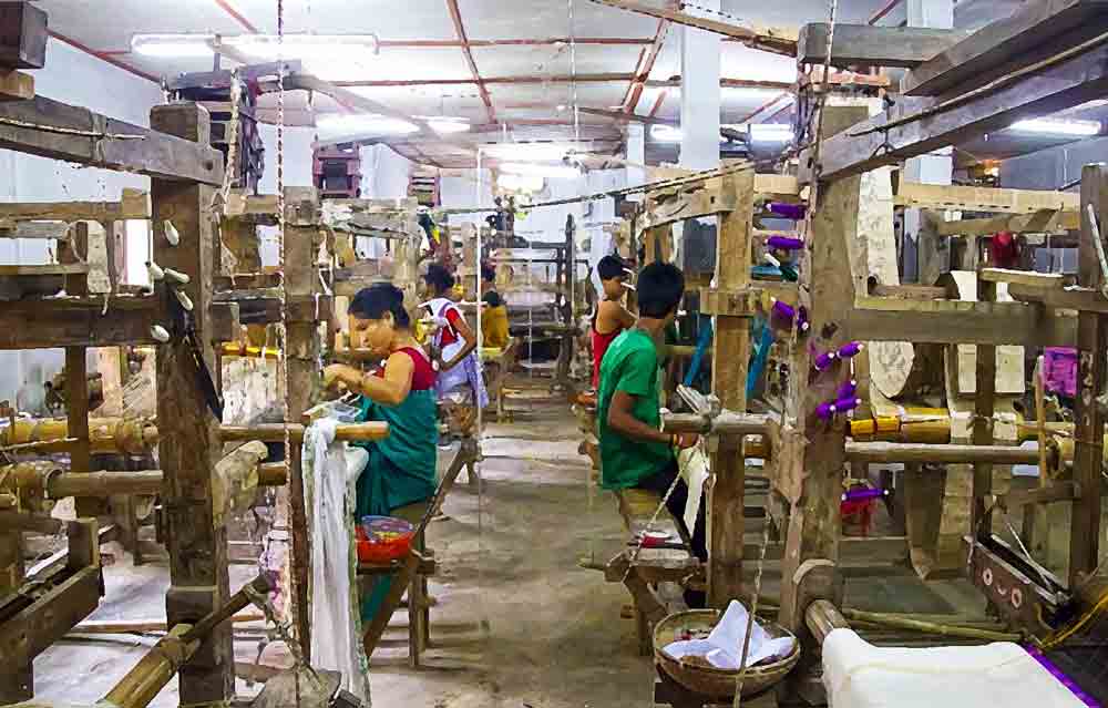Weavers at work in Sualkuchi